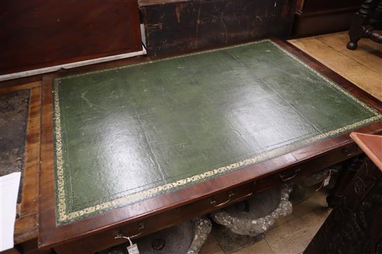 A Victorian mahogany partners writing table, with green gilt tooled leather inset top W.150cm